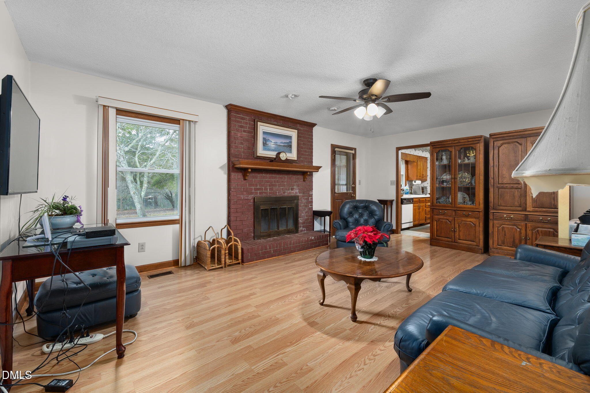 2024 Angier Road Fuquay-Varina, NC 27526 - Photo 13 of 35 a living room with furniture fireplace and window