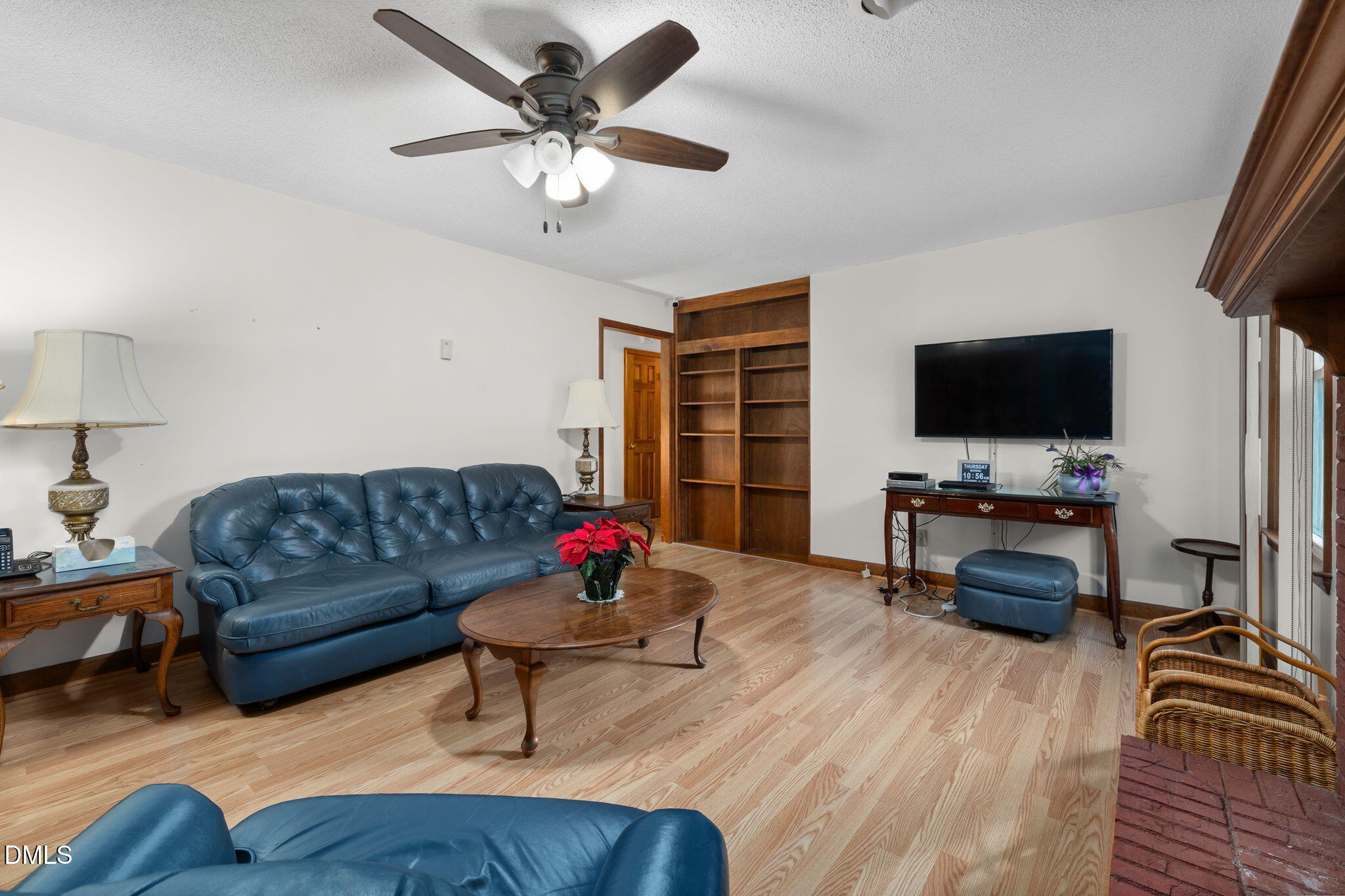 2024 Angier Road Fuquay-Varina, NC 27526 - Photo 14 of 35 a living room with furniture and a flat screen tv