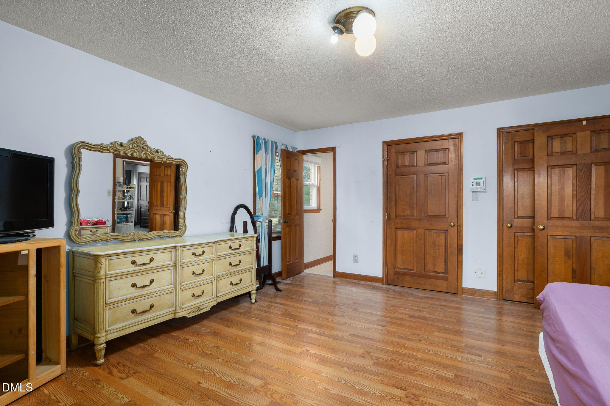 2024 Angier Road Fuquay-Varina, NC 27526 - Photo 22 of 35 a room with a dresser and a mirror