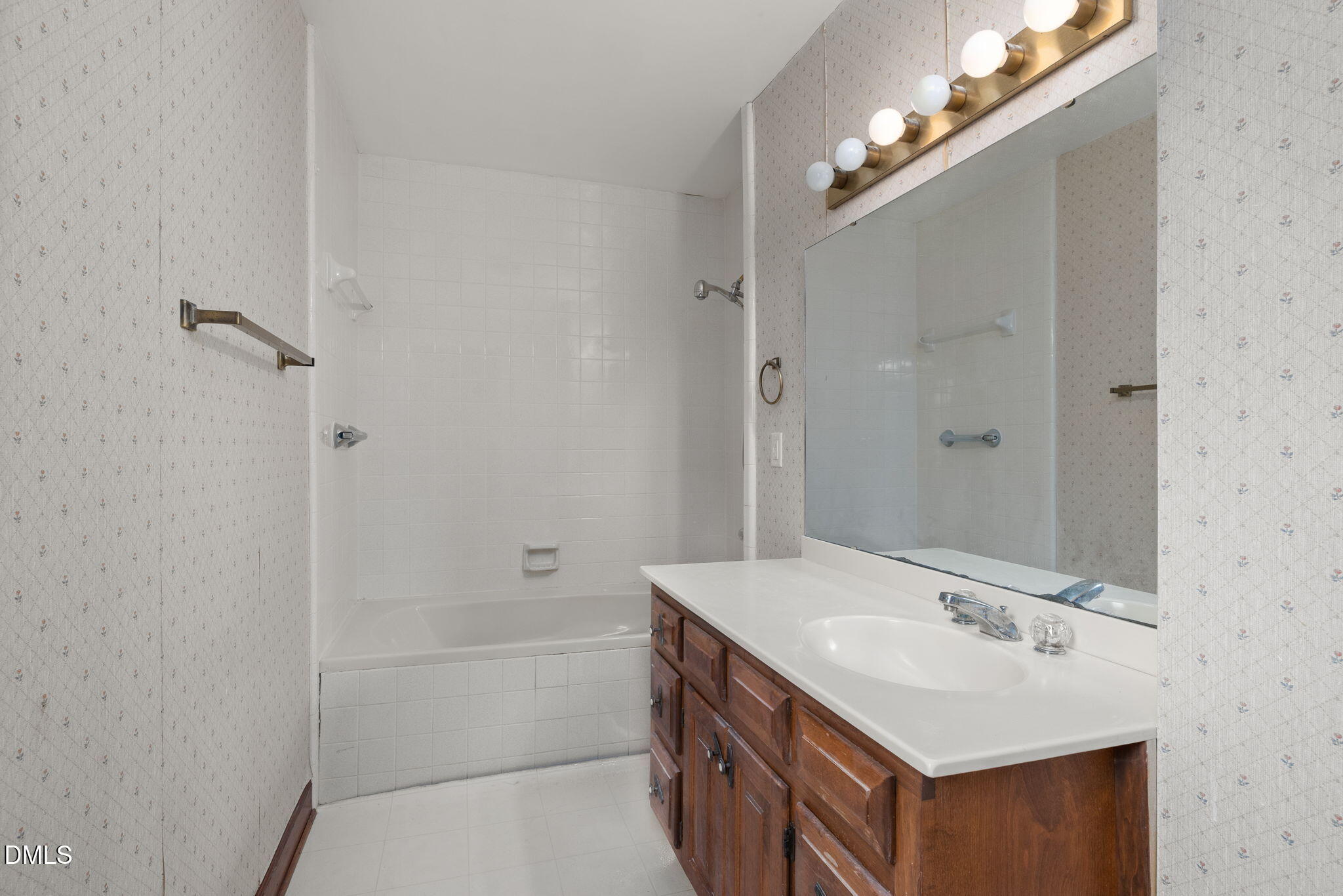 2024 Angier Road Fuquay-Varina, NC 27526 - Photo 23 of 35 a bathroom with a sink a toilet a shower and a mirror