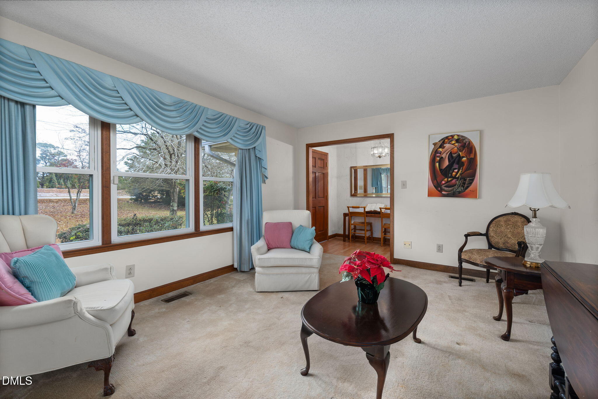2024 Angier Road Fuquay-Varina, NC 27526 - Photo 6 of 35 a living room with furniture and a large window