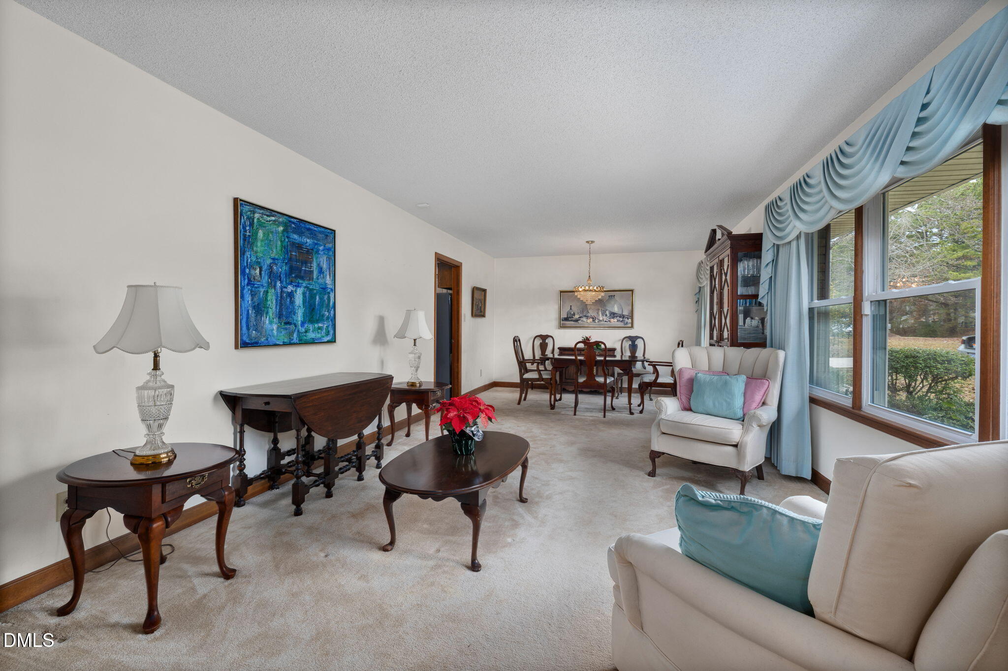 2024 Angier Road Fuquay-Varina, NC 27526 - Photo 8 of 35 a living room with furniture and a large window
