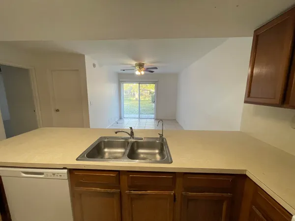 a room with a sink and dishwasher