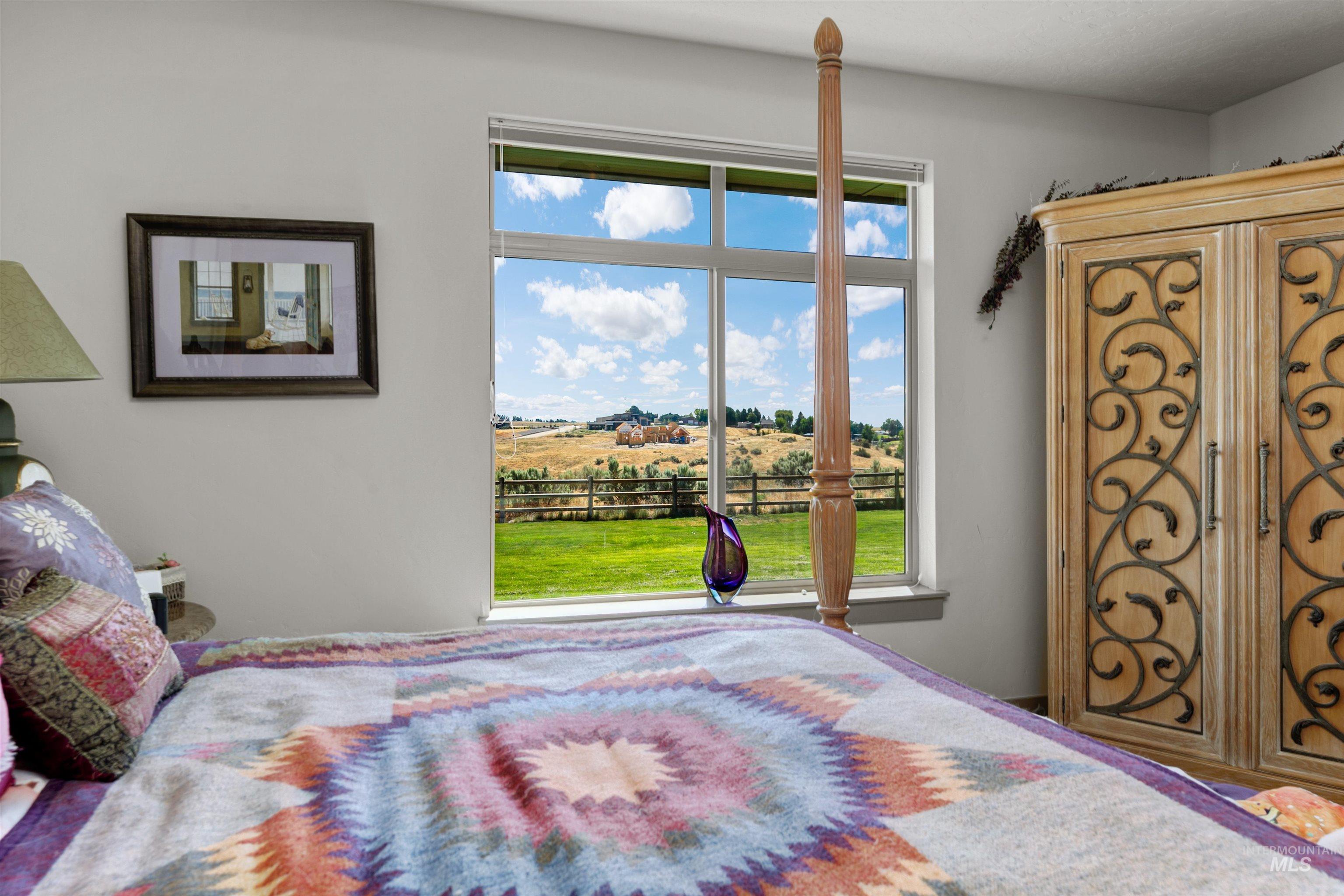 24398 Tombstone Ridge Court Middleton, ID 83644 - Photo 20 of 47 Large window featuring a scenic outdoor backdrop of rolling hills and green space