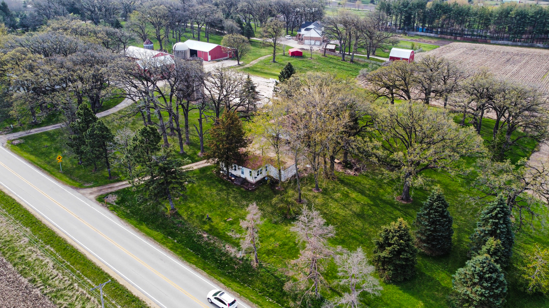 15419 Marengo Road Union, IL 60180 - Photo 16 of 21 a view of a house with a yard and plants