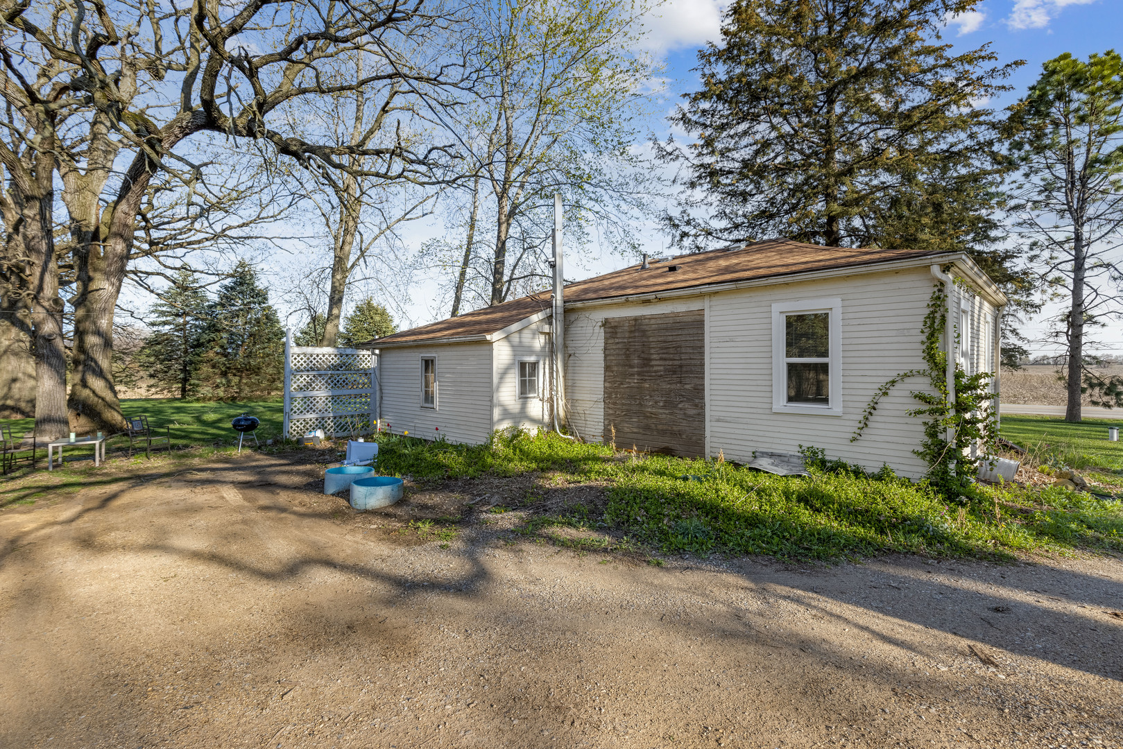 15419 Marengo Road Union, IL 60180 - Photo 5 of 21 a backyard of a house with plants and trees