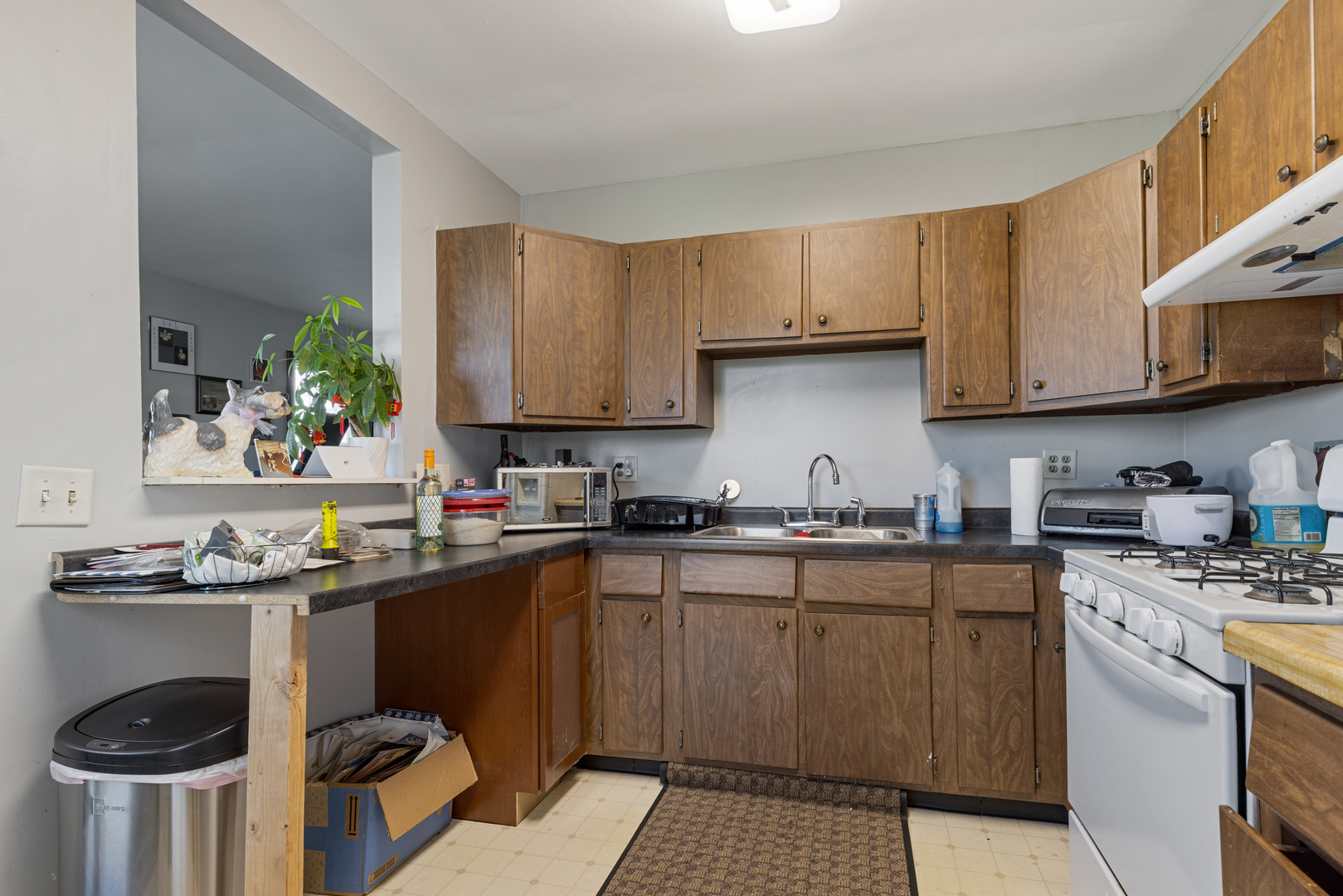 15419 Marengo Road Union, IL 60180 - Photo 6 of 21 a kitchen with a sink a stove and cabinets