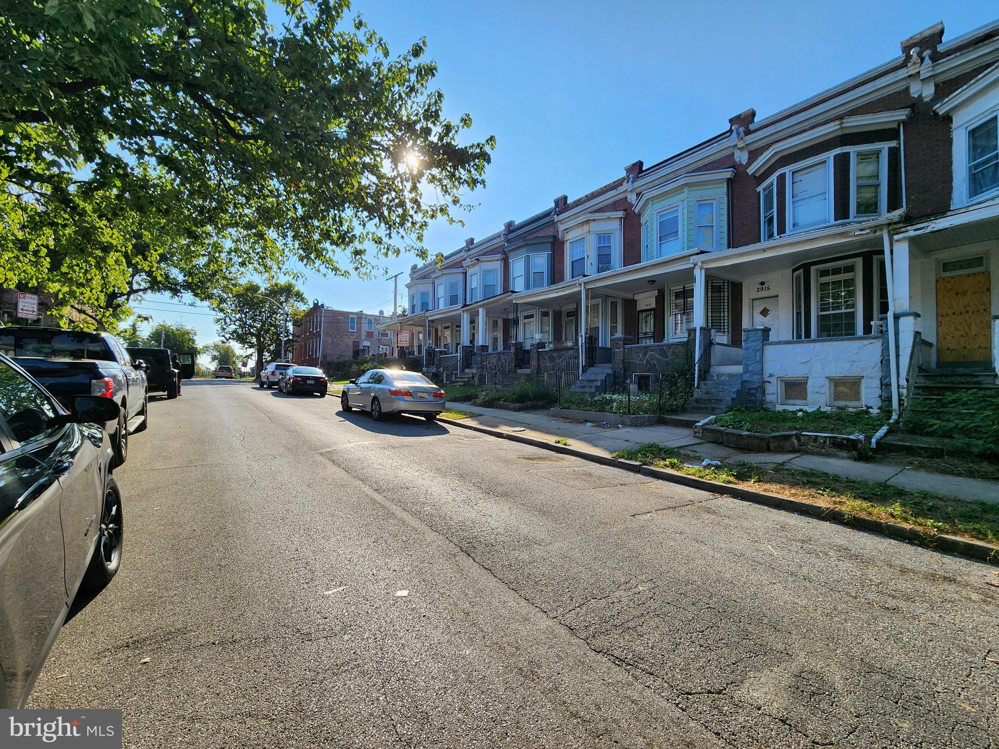 2915 Mosher Street Baltimore, MD 21216 - Photo 3 of 3 a cars parked in front of brick building