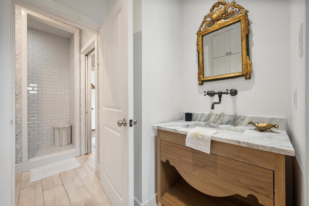 3824 Bishops Flower Road Fort Worth, TX 76109 - Photo 25 of 38 a bathroom with a granite countertop sink a mirror and shower
