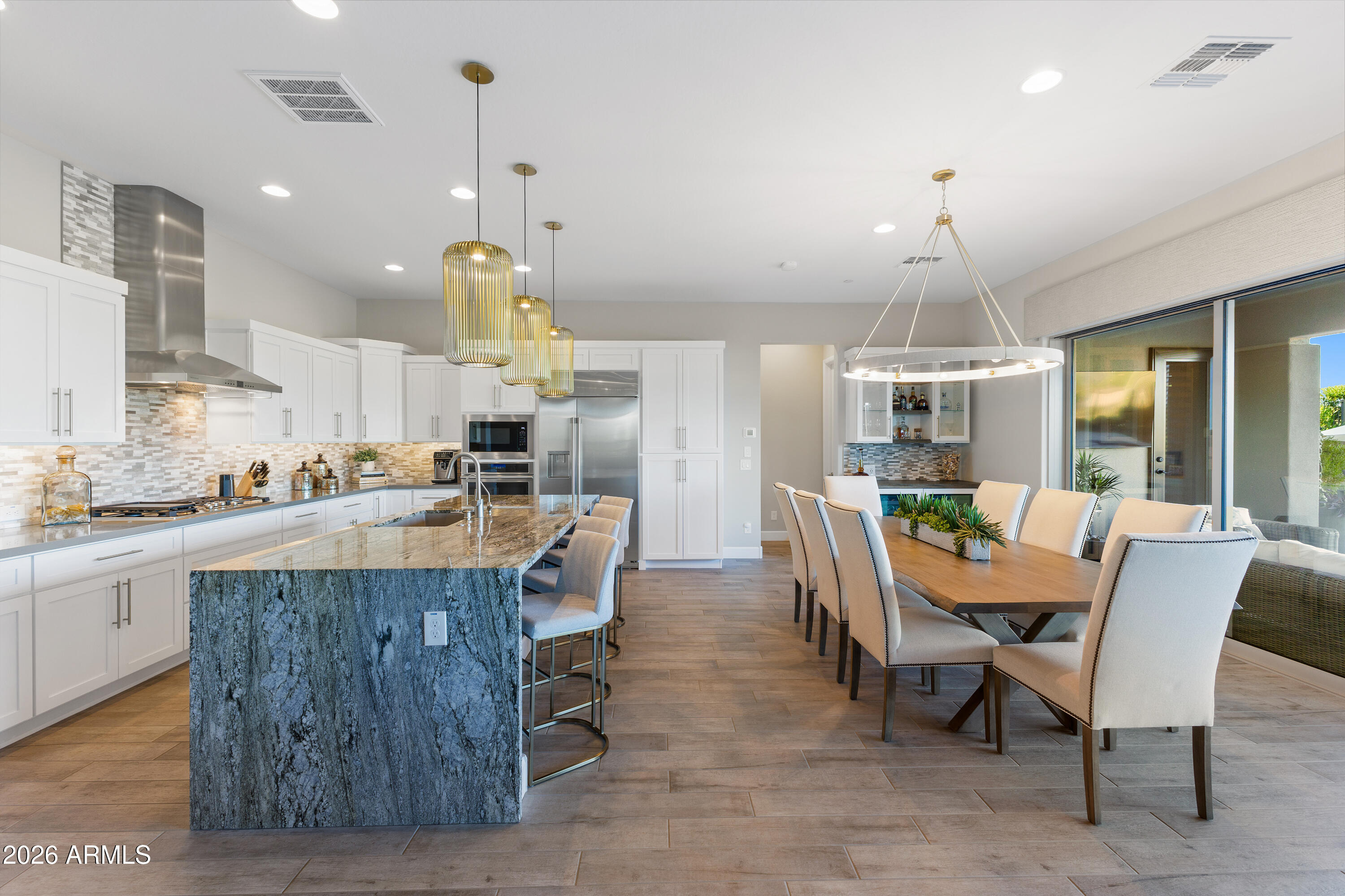 28803 North Sandal Court Rio Verde, AZ 85263 - Photo 10 of 85 a view of a dining room with furniture window and wooden floor