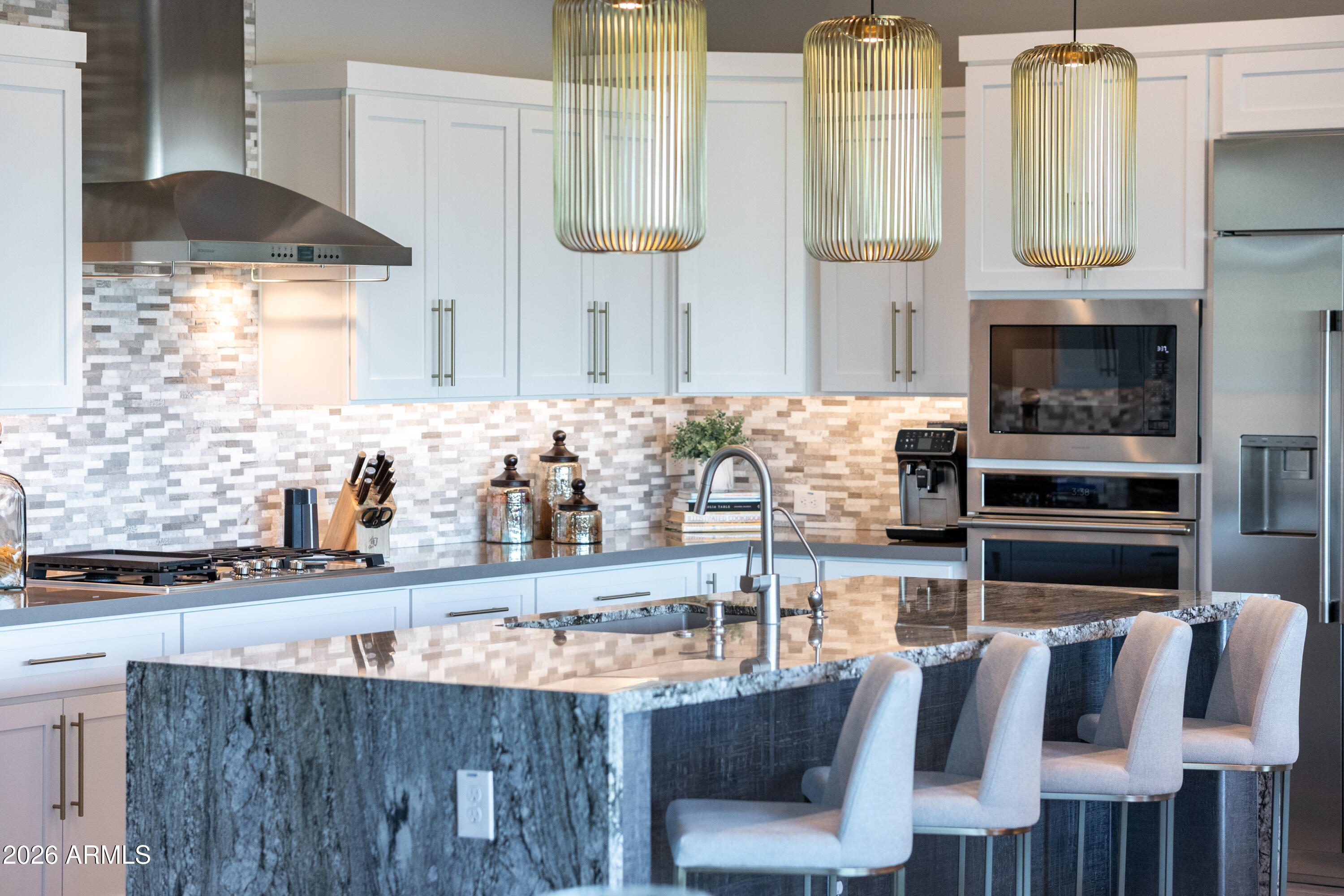 28803 North Sandal Court Rio Verde, AZ 85263 - Photo 14 of 85 a kitchen with granite countertop a stove and white cabinets
