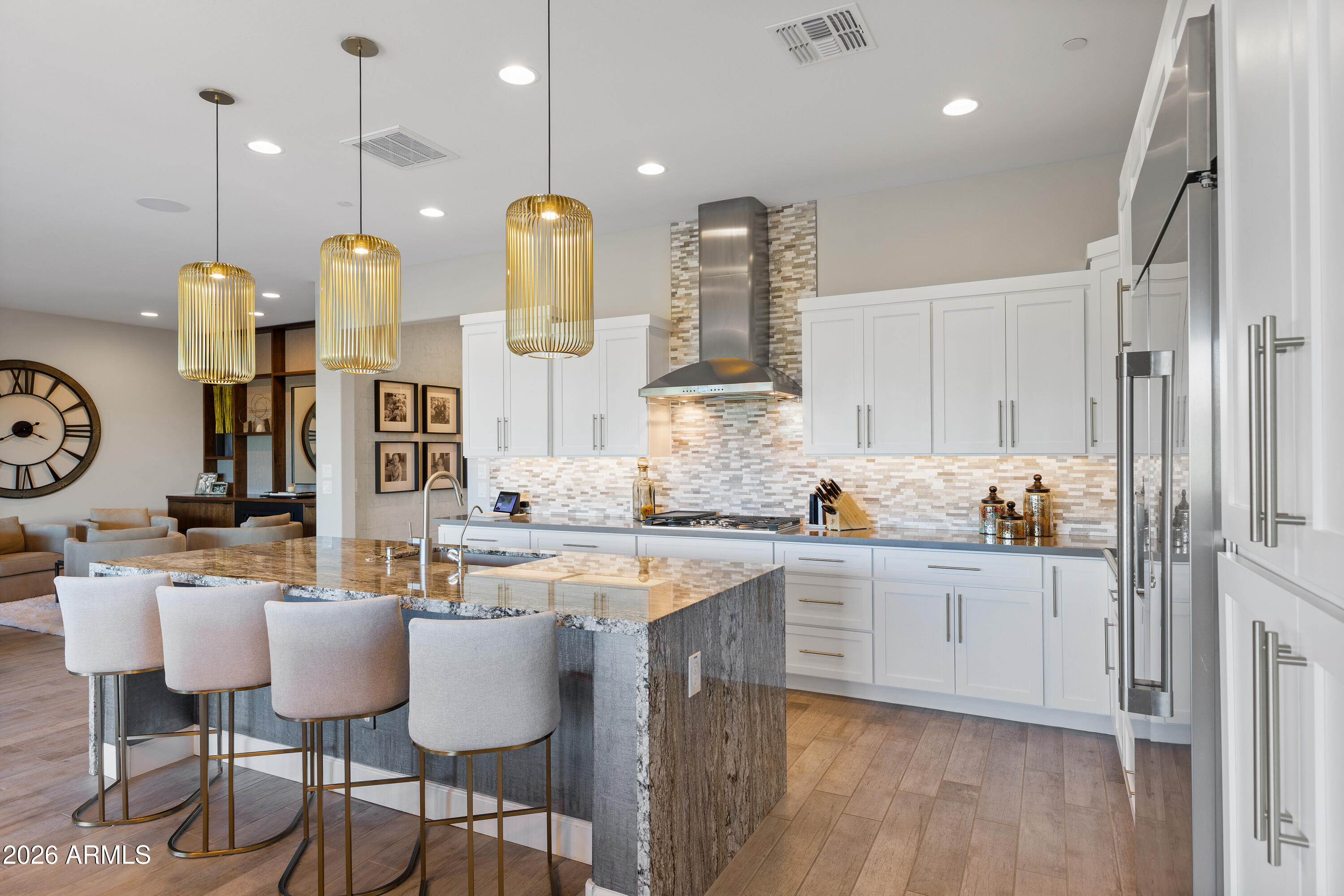 28803 North Sandal Court Rio Verde, AZ 85263 - Photo 16 of 85 a kitchen with stainless steel appliances granite countertop a sink a stove and a wooden floors