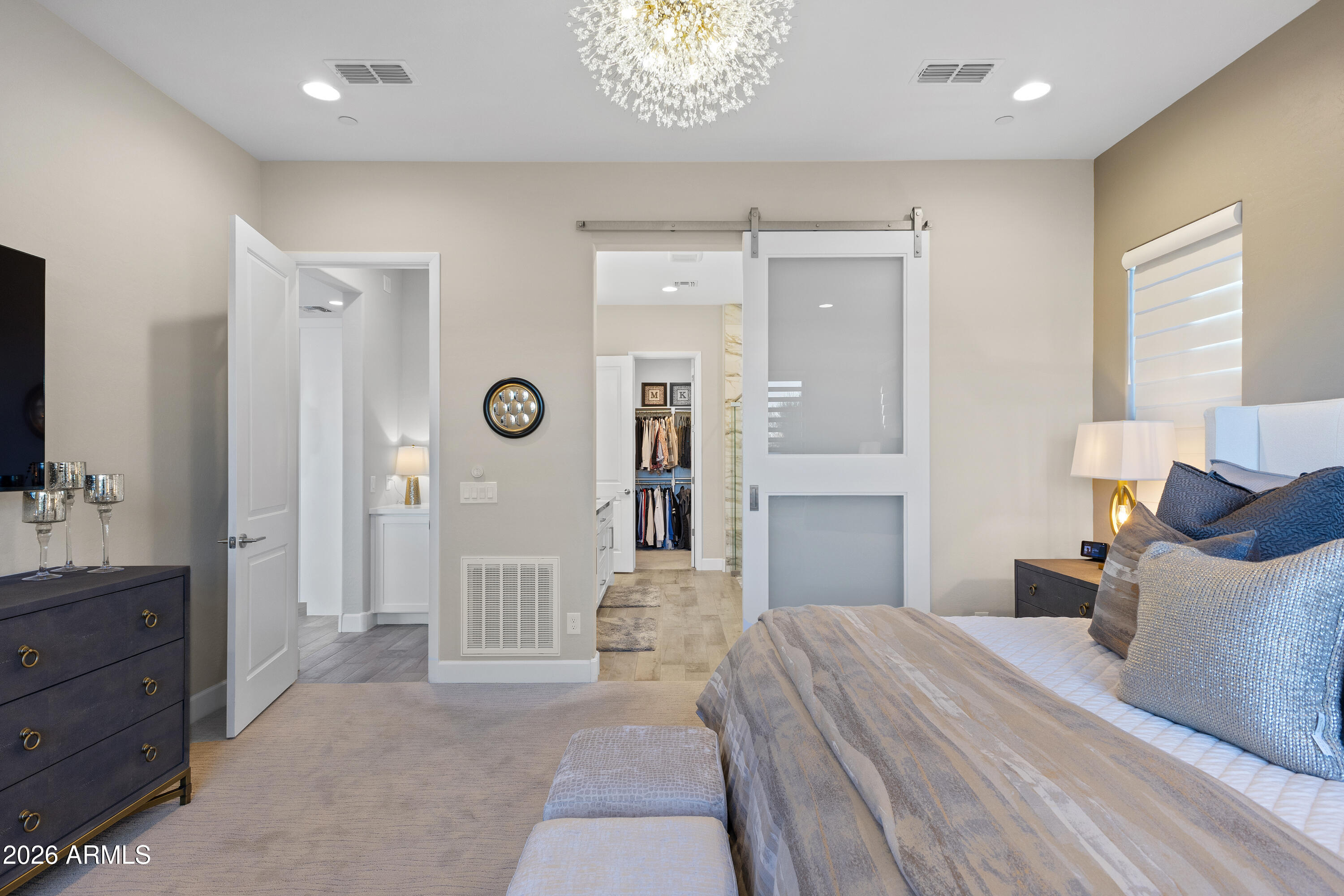 28803 North Sandal Court Rio Verde, AZ 85263 - Photo 26 of 85 a bedroom with a bed and a chandelier