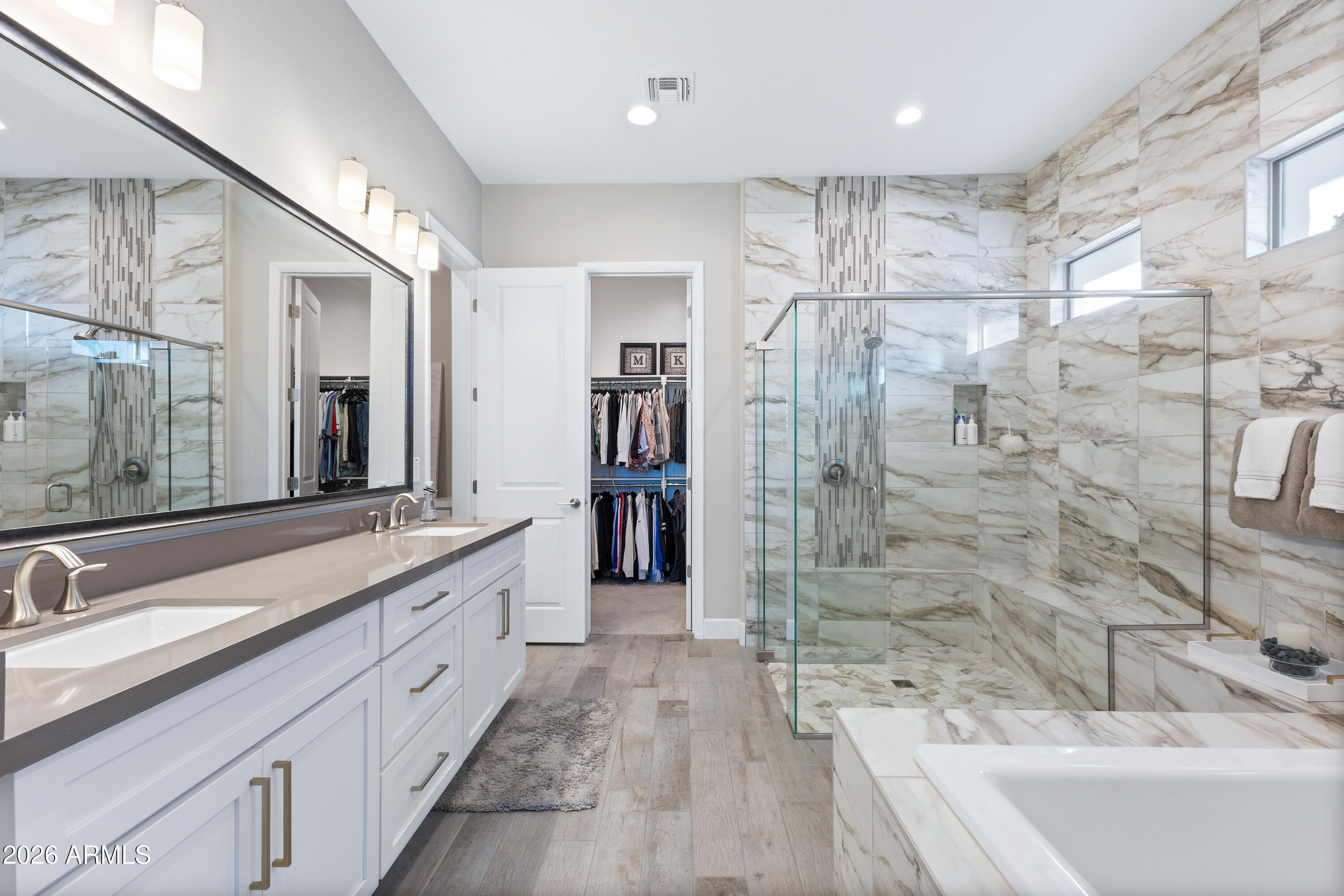 28803 North Sandal Court Rio Verde, AZ 85263 - Photo 27 of 85 a spacious bathroom with a double vanity sink a large mirror and shower