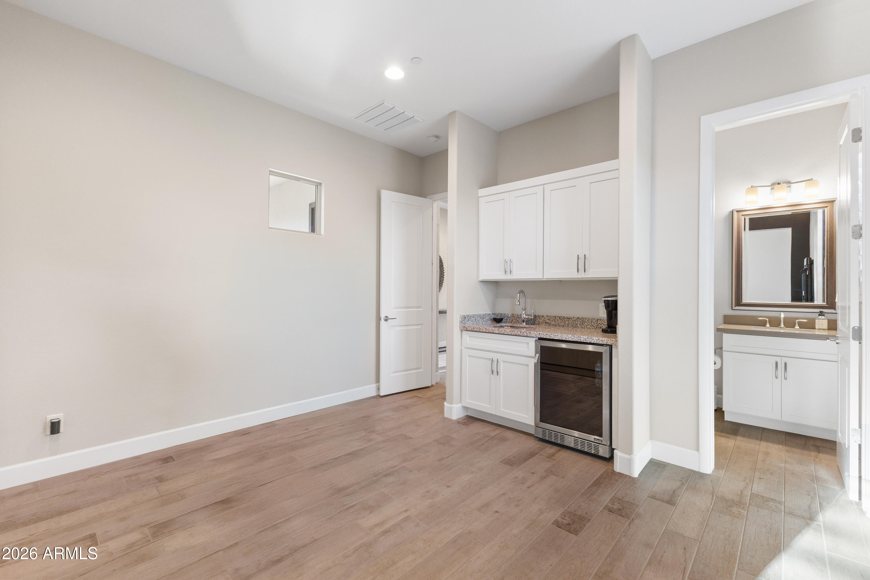 28803 North Sandal Court Rio Verde, AZ 85263 - Photo 34 of 85 a kitchen with granite countertop white cabinets and stainless steel appliances