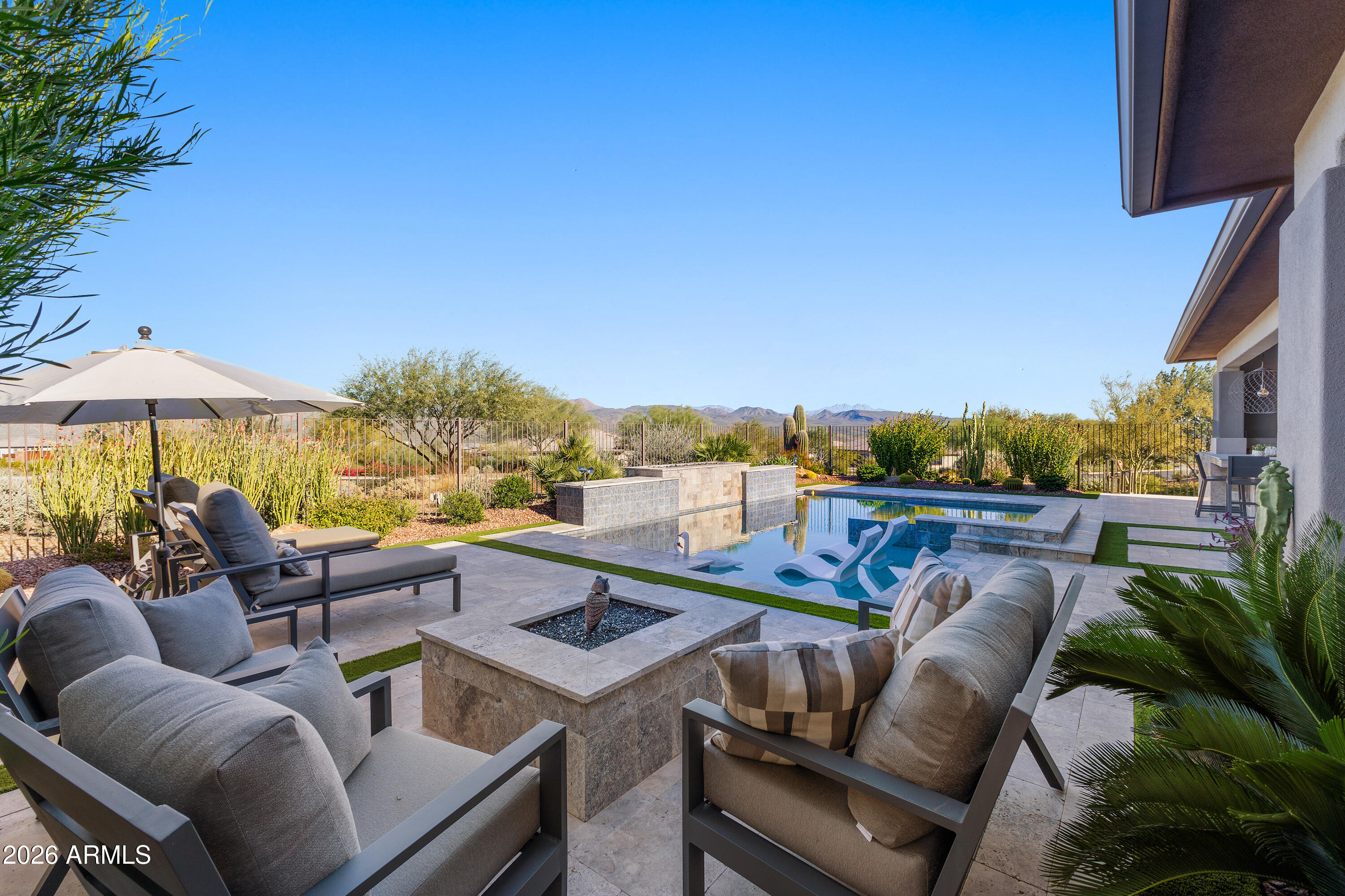 28803 North Sandal Court Rio Verde, AZ 85263 - Photo 41 of 85 a view of a patio with couches under an umbrella