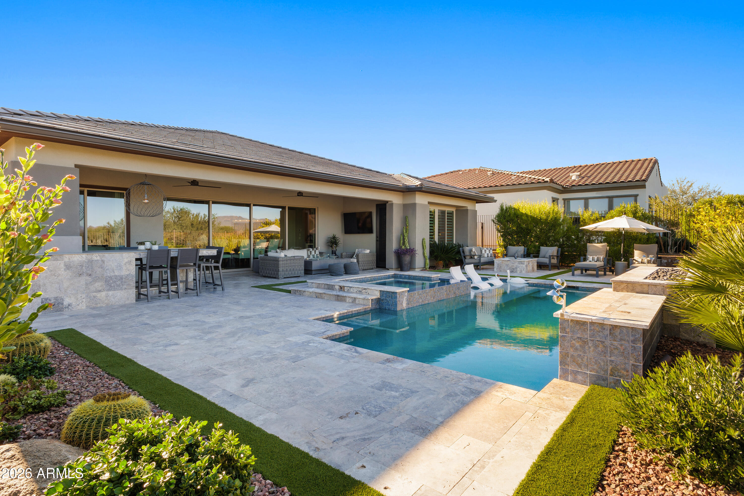 28803 North Sandal Court Rio Verde, AZ 85263 - Photo 46 of 85 a view of a patio with couches and a table and chairs with plants