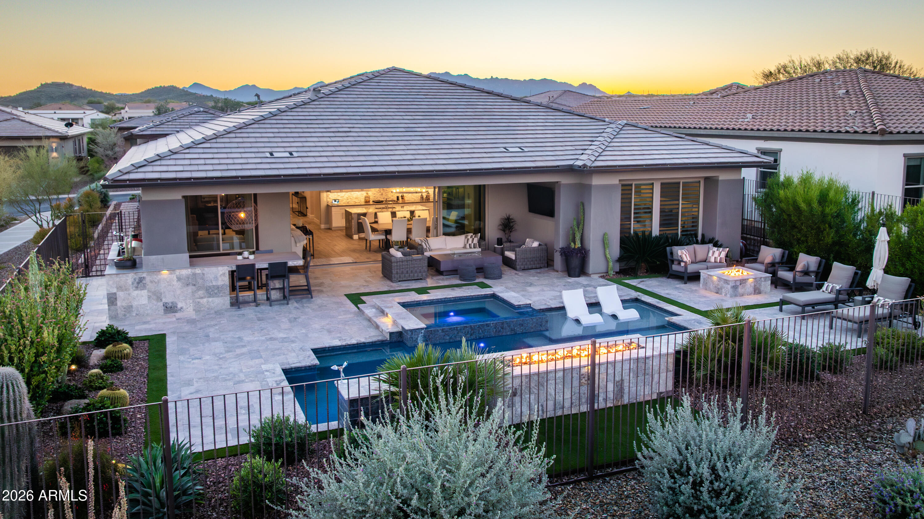 28803 North Sandal Court Rio Verde, AZ 85263 - Photo 69 of 85 a view of a patio with table and chairs potted plants and palm tree