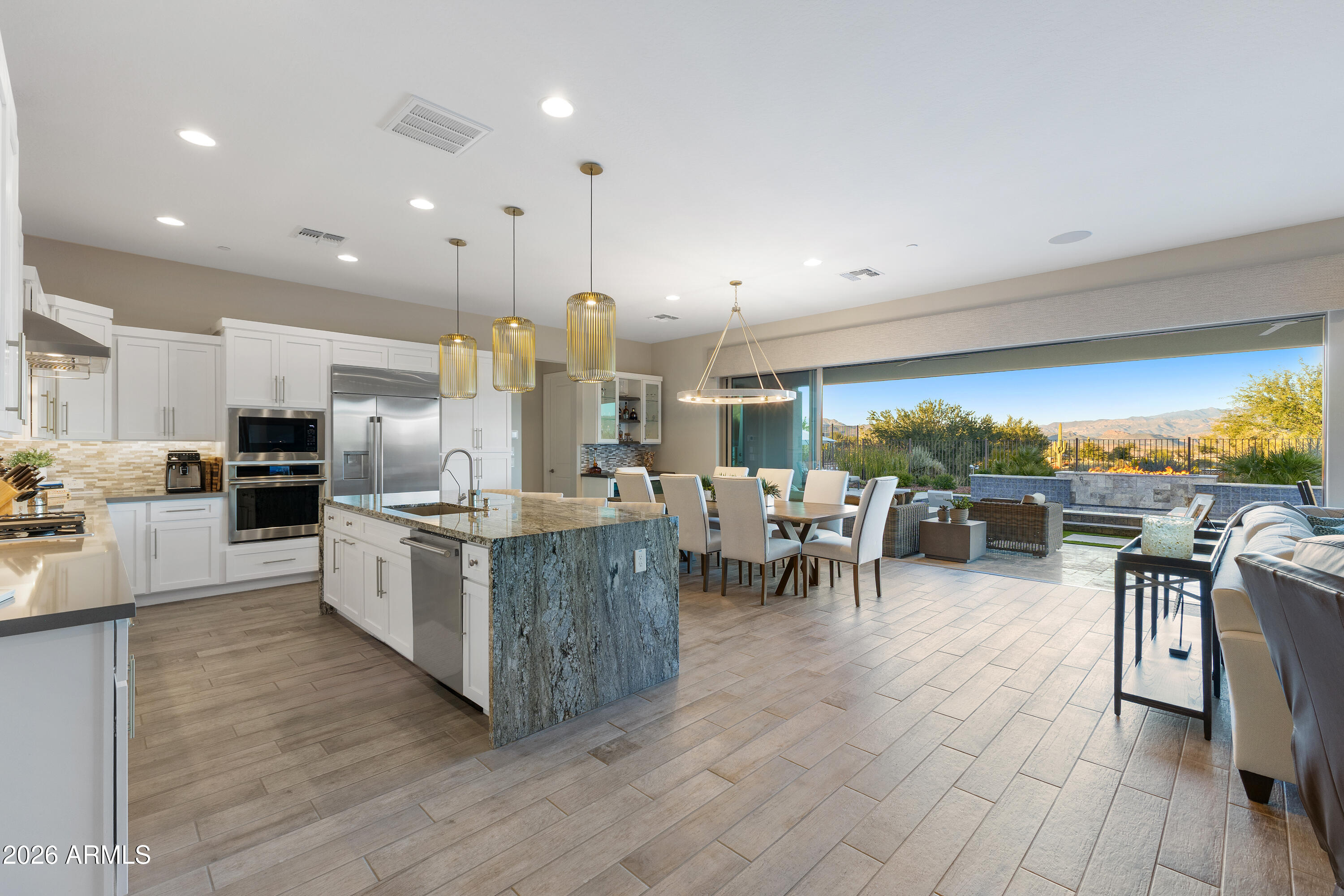 28803 North Sandal Court Rio Verde, AZ 85263 - Photo 6 of 85 a large kitchen with lots of furniture and stainless steel appliances