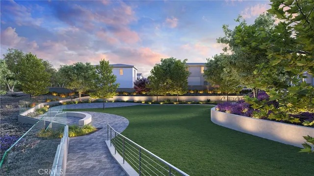 a view of a swimming pool and lounge chairs on th terrace