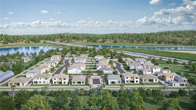 an aerial view of a city with lots of residential buildings and lake view