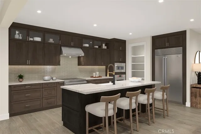 a kitchen with a sink a table and chairs