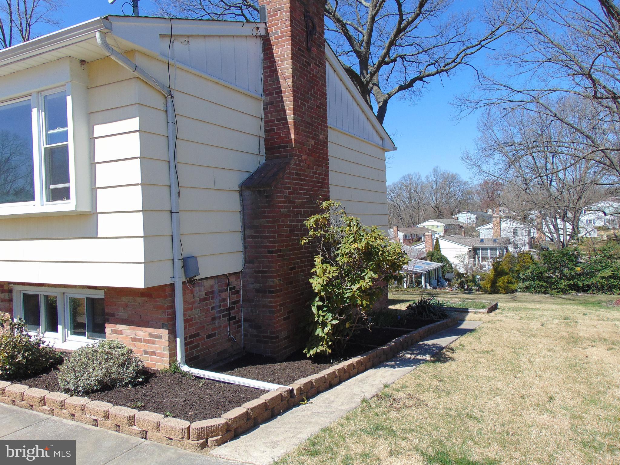 760 Hawthorne Road Linthicum Heights, MD 21090 - Photo 5 of 82 Right front side of home with path to backyard.