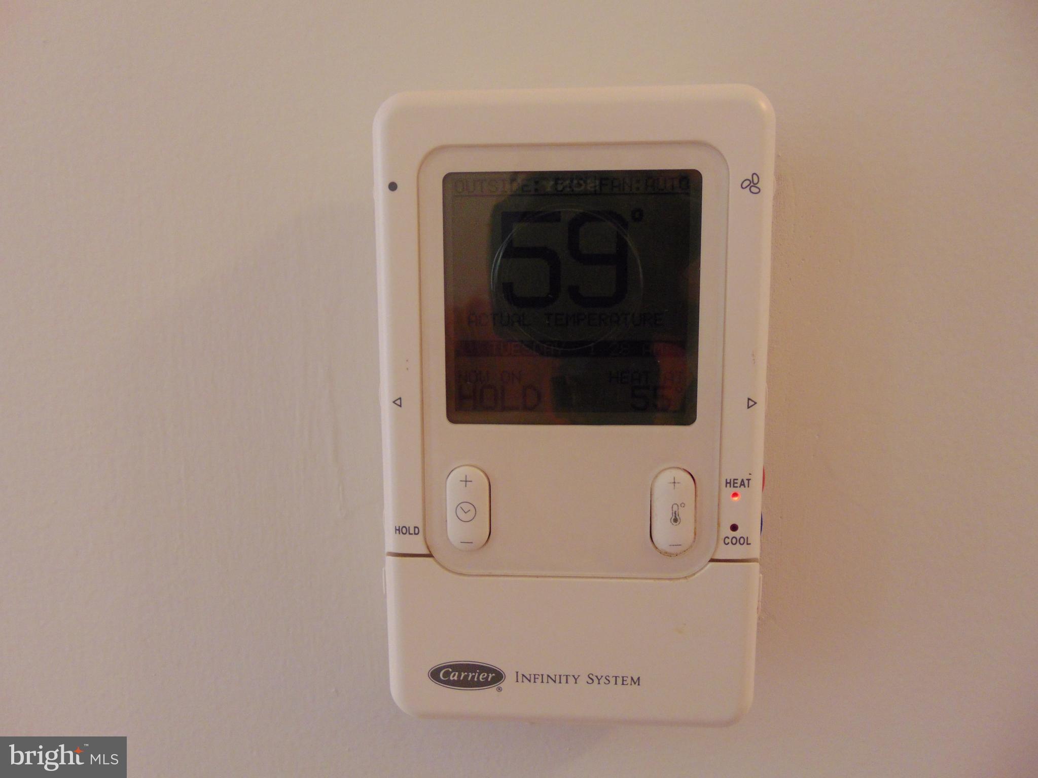 760 Hawthorne Road Linthicum Heights, MD 21090 - Photo 49 of 82 Carrier HVAC. Thermostat in upstairs hallway.