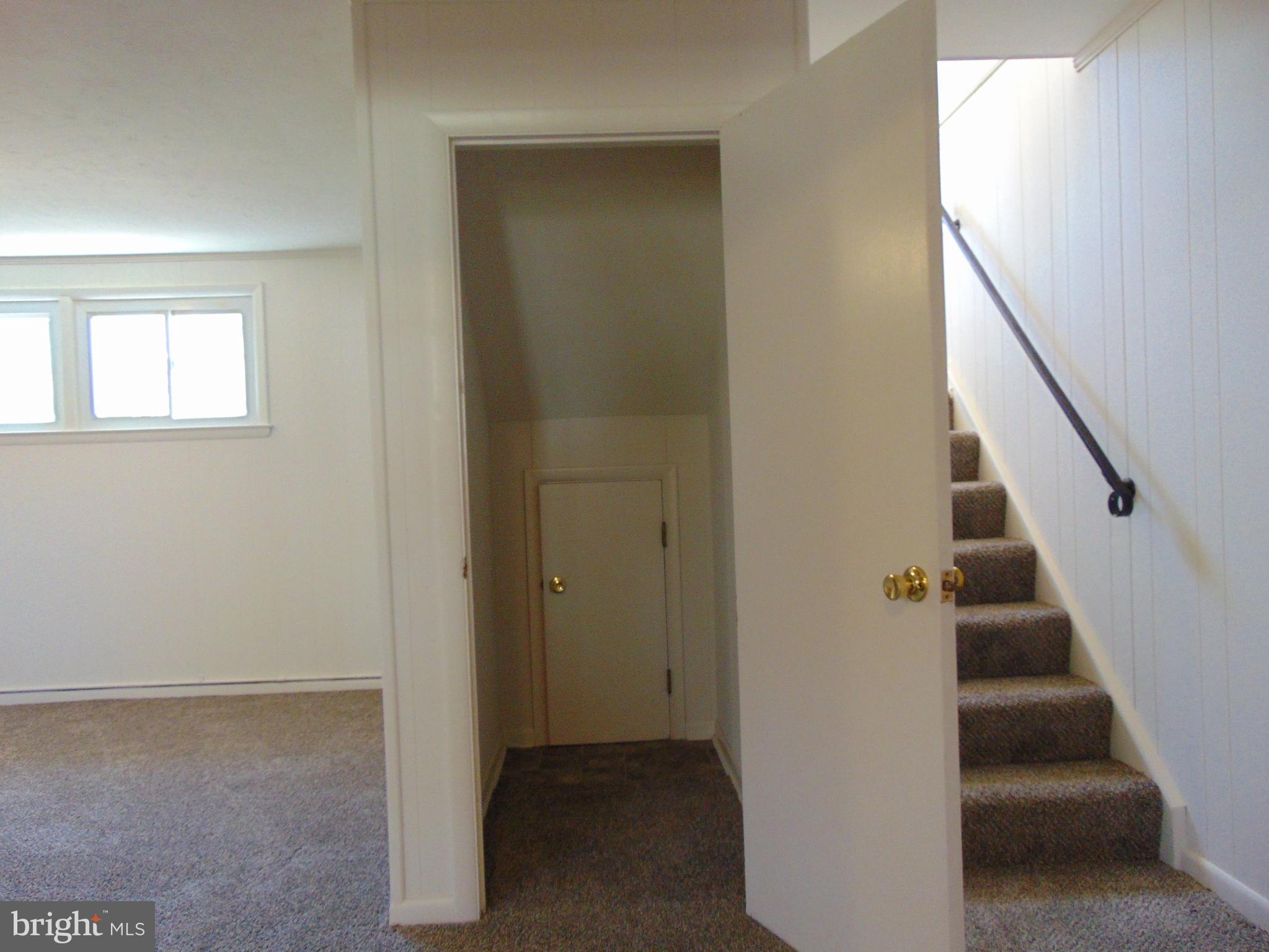 760 Hawthorne Road Linthicum Heights, MD 21090 - Photo 53 of 82 Closet in basement with storage under stairs.