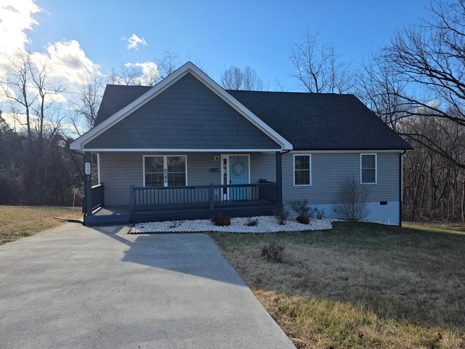 424 Patrick Street Lynchburg, VA 24501 - Photo 1 of 30 a front view of a house with a garden and yard