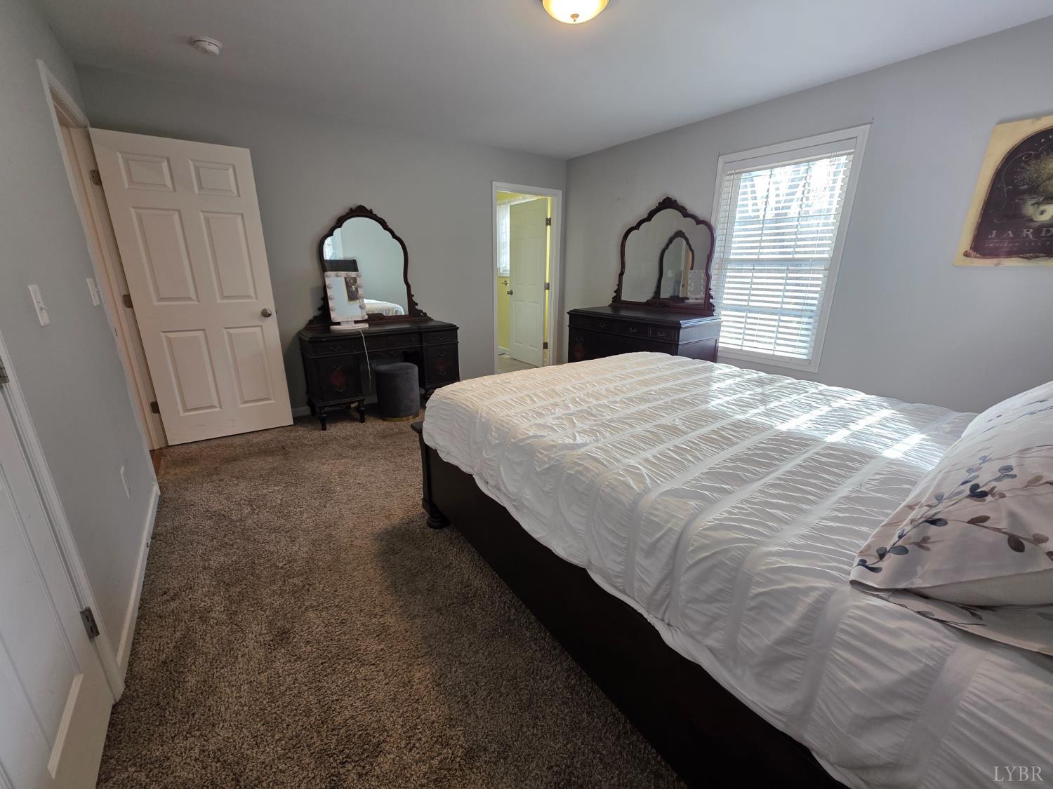 424 Patrick Street Lynchburg, VA 24501 - Photo 14 of 30 a bedroom with a bed window and dresser
