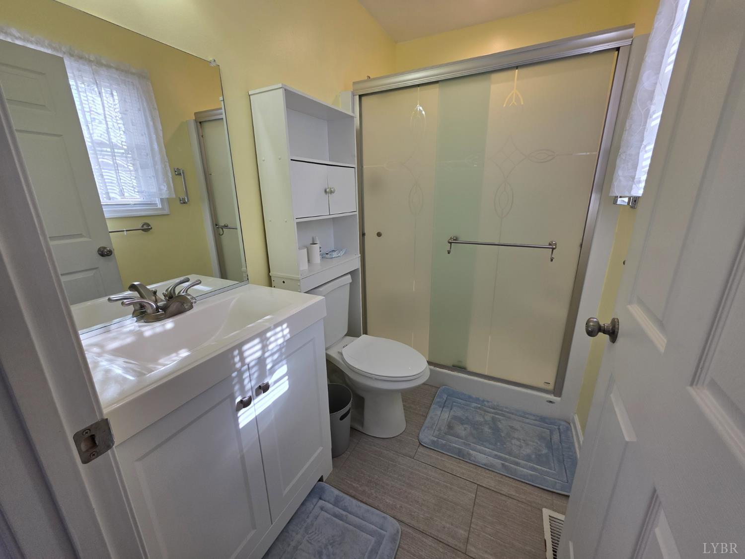 424 Patrick Street Lynchburg, VA 24501 - Photo 15 of 30 a bathroom with a granite countertop sink toilet and shower