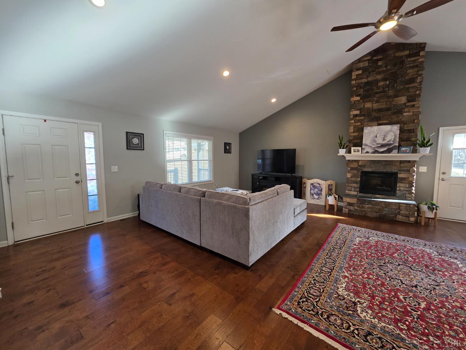424 Patrick Street Lynchburg, VA 24501 - Photo 3 of 30 a living room with furniture flat screen tv and a fireplace