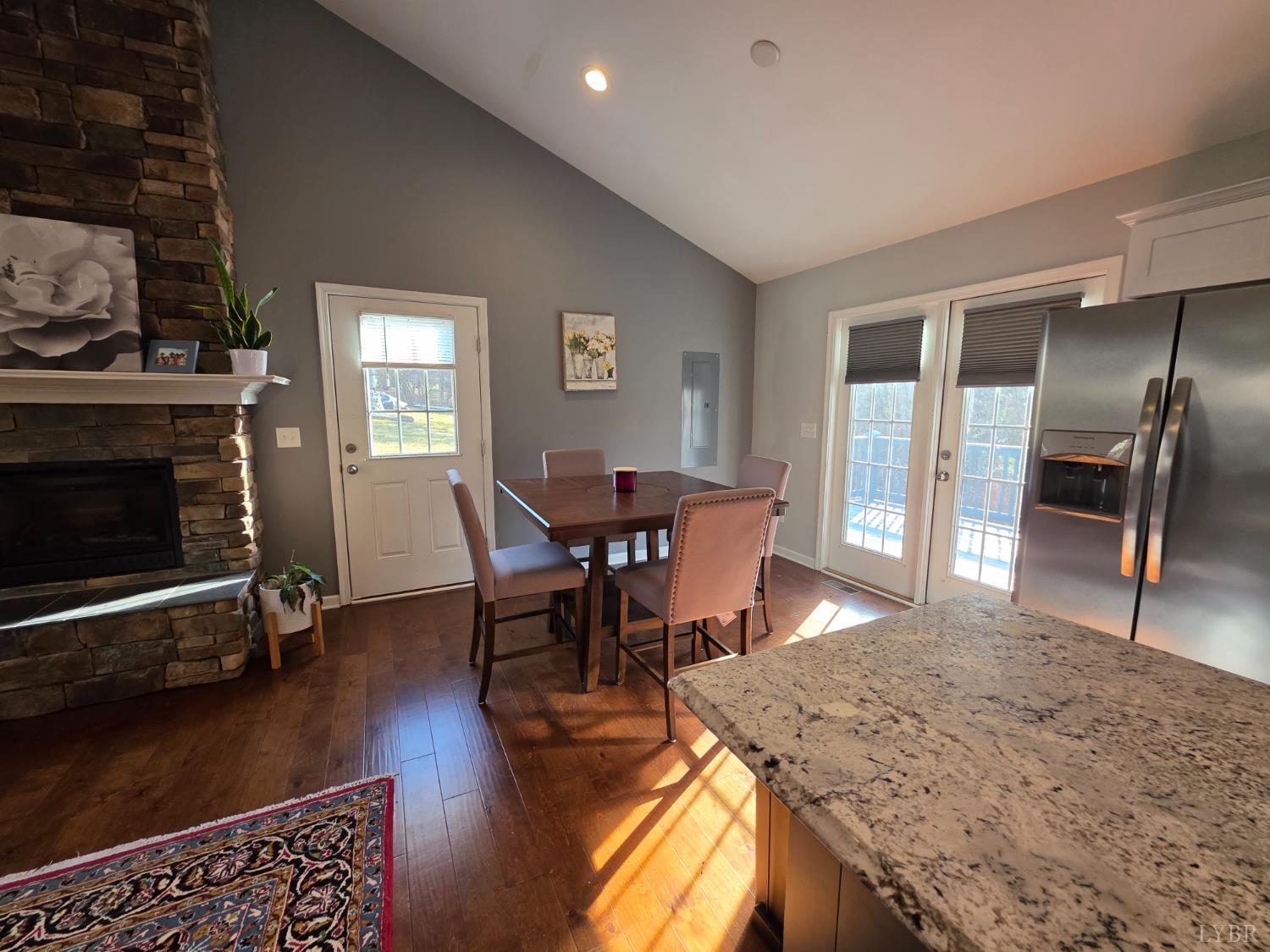424 Patrick Street Lynchburg, VA 24501 - Photo 5 of 30 a view of a dining room with furniture and a fireplace