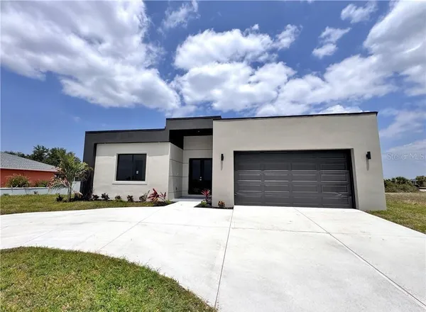 a view of house with yard and entertaining space