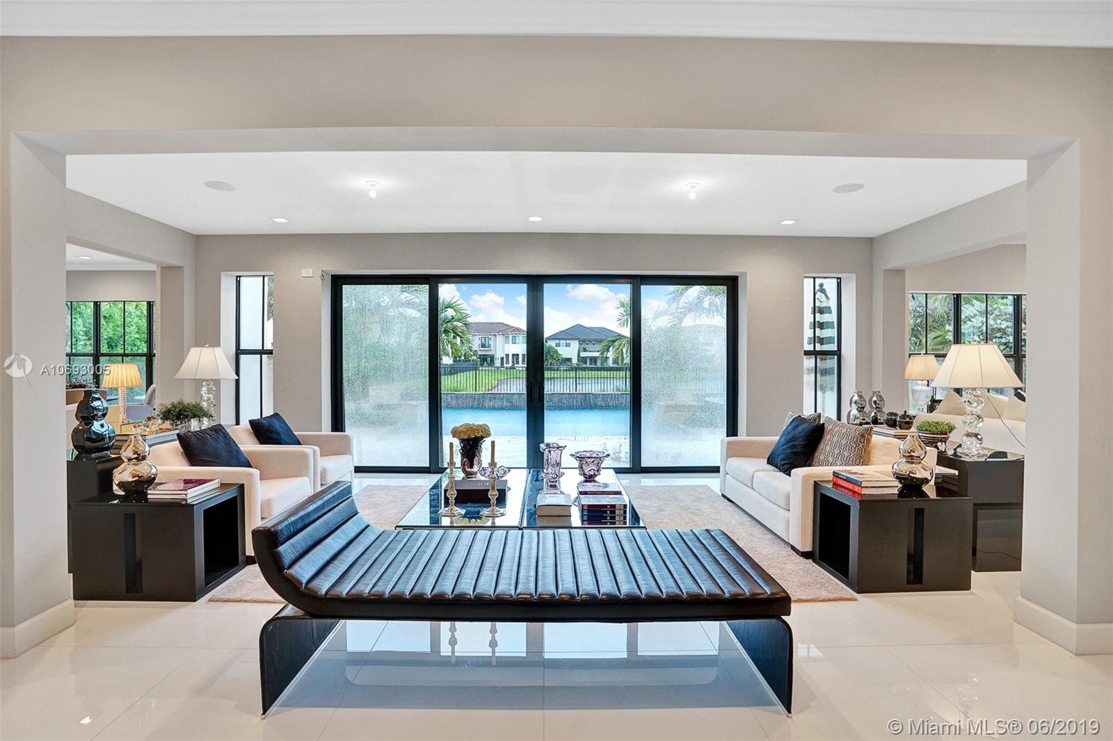 17591 Cadena Drive Boca Raton, FL 33496 - Photo 23 of 56 LIVING ROOM 2 + POOL VIEW IN THE BACKGROUND