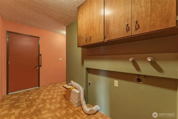 a view of room with window and wardrobe