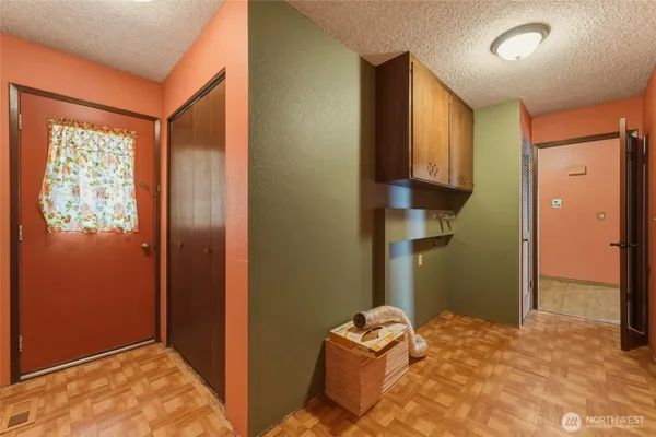 a view of a room with wooden walls