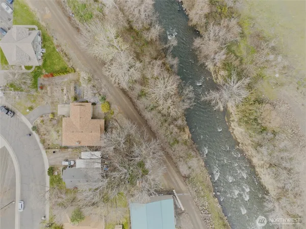 an aerial view of a house with a yard