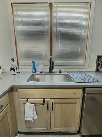 a bedroom with a bed and ceiling fan