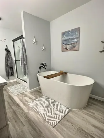 a bathroom with a glass shower door