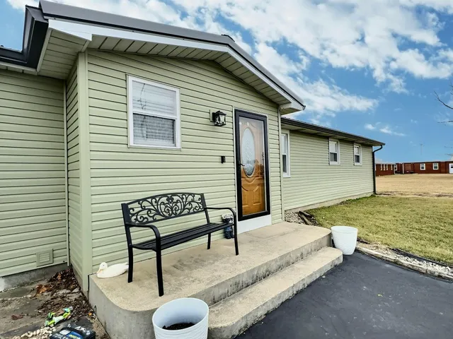 a view of a yard with large trees