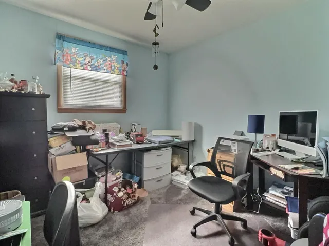 a view of a workspace with furniture