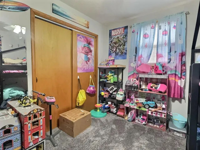 a living room with furniture and a rug