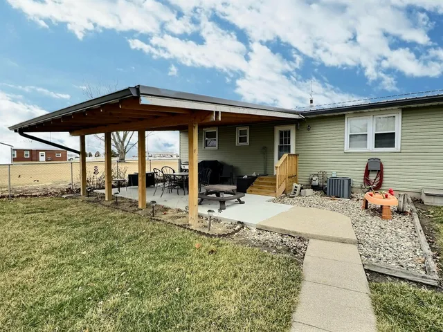 a view of a tables and chairs in patio