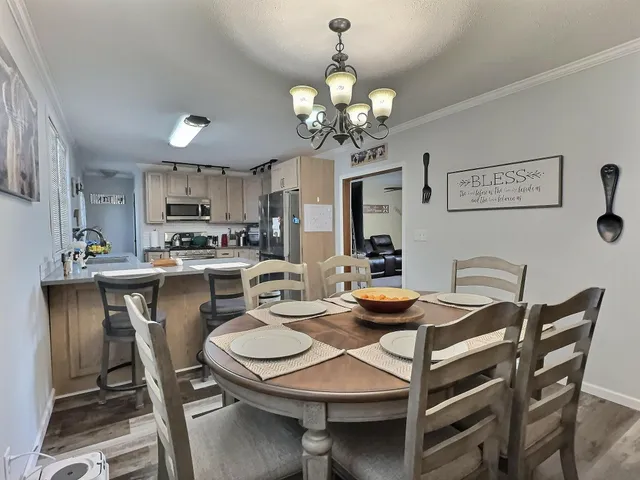 a kitchen with a sink and stove