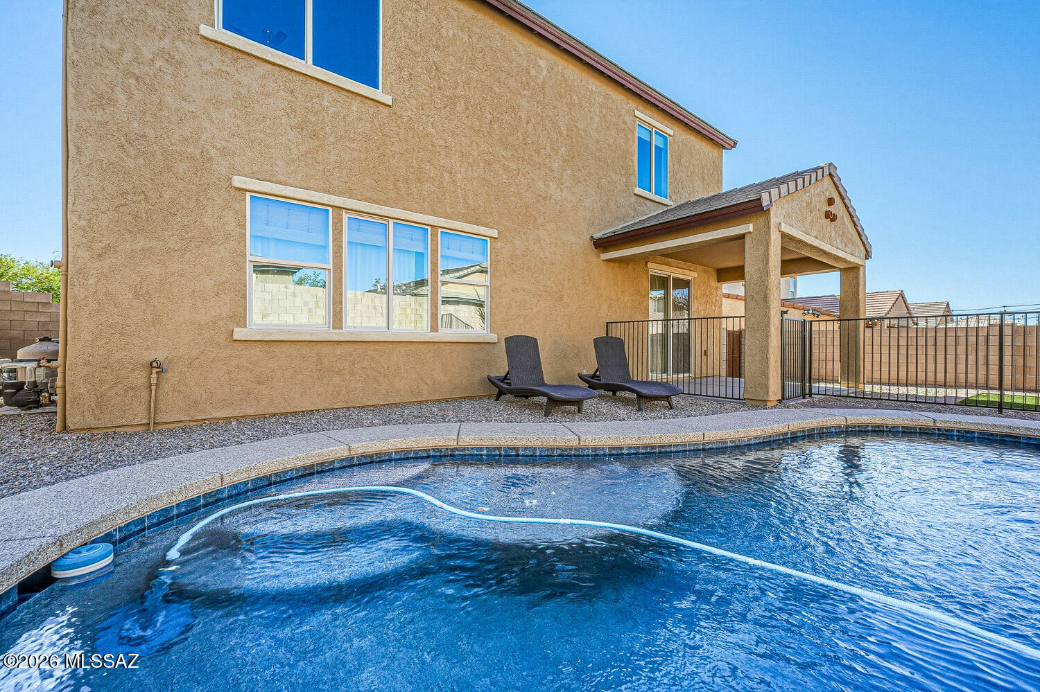 323 East Refuge Loop Vail, AZ 85641 - Photo 47 of 51 a front view of a house with swimming pool