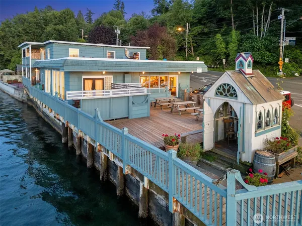 a view of a house with wooden deck