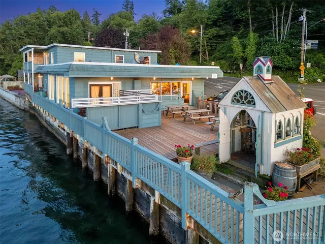 a view of a house with wooden deck