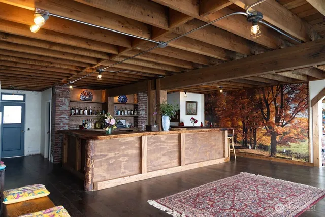 a living room with lots of furniture and clutter